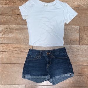 cute white crop top with cuffed dark shorts